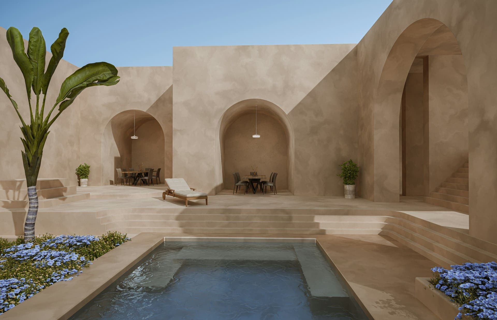 Pool courtyard with stone arches and a shaded outdoor seating area